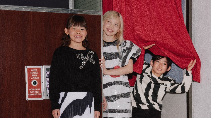 Image of a boy in green sweater